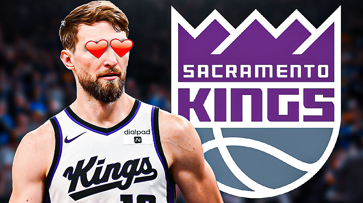 Domantas Sabonis with hearts in his eyes beside the Sacramento Kings logo