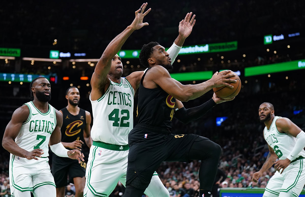 Cleveland Cavaliers guard Donovan Mitchell (45) drives the ball against Boston Celtics center Al Horford (42) in the second quarter during game two of the second round for the 2024 NBA playoffs at TD Garden.