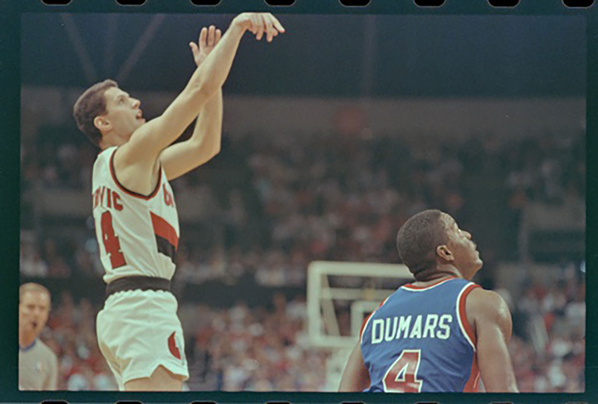 Trailblazers' Drazen Petrovic shoots the ball while being guarded by Pistons'' Joe Dumars during game three of the 1990 NBA Finals at The Memorial Coliseum.