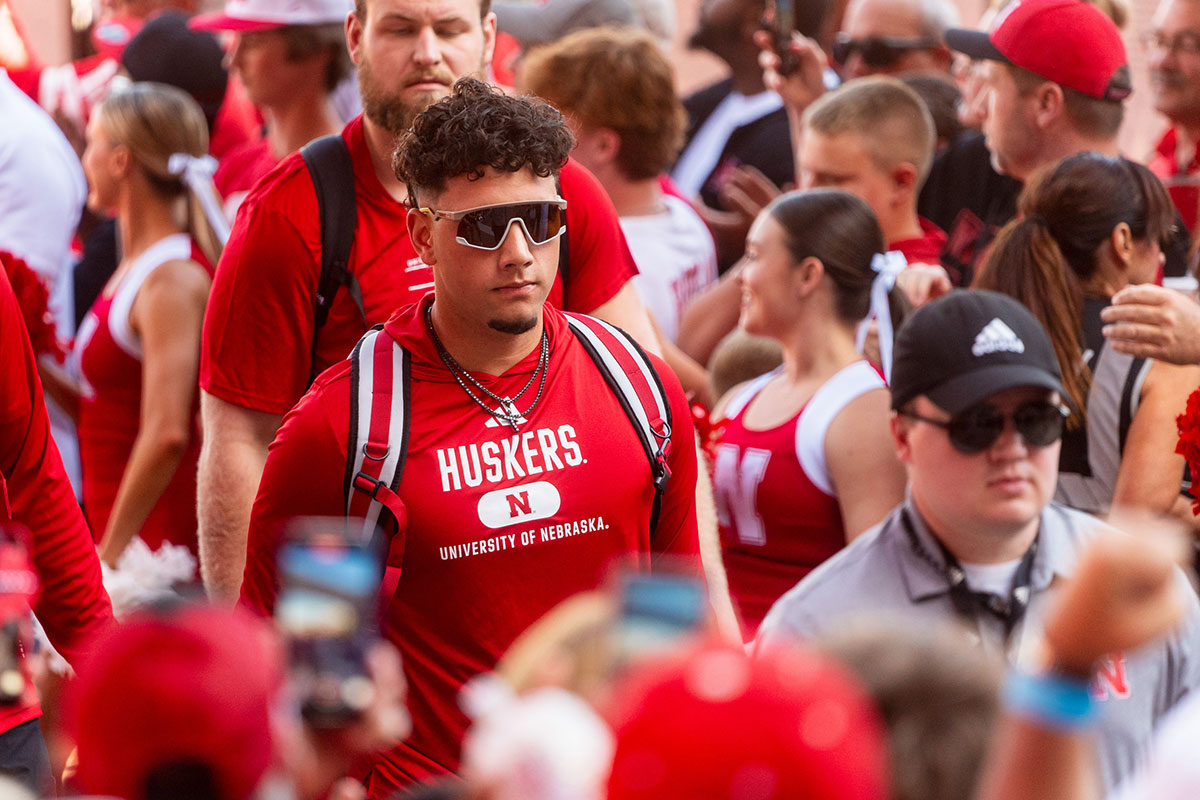 Nebraska Cornhuskers quarterback Dylan Raiola (15) leads the team into the facilities before the game against the Colorado Buffaloes at Memorial Stadium.