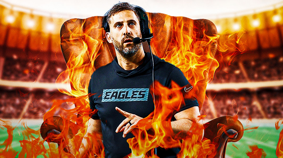 Nick Sirriani sitting in a chair with fire around or behind him