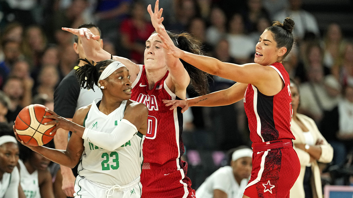 Nigeria point guard Ezinne Kalu (23) handles the ball against United States power forward Breanna Stewart (10) and guard Kelsey Plum (5) in the women’s basketball quarterfinals during the Paris 2024 Olympic Summer Games at Accor Arena.