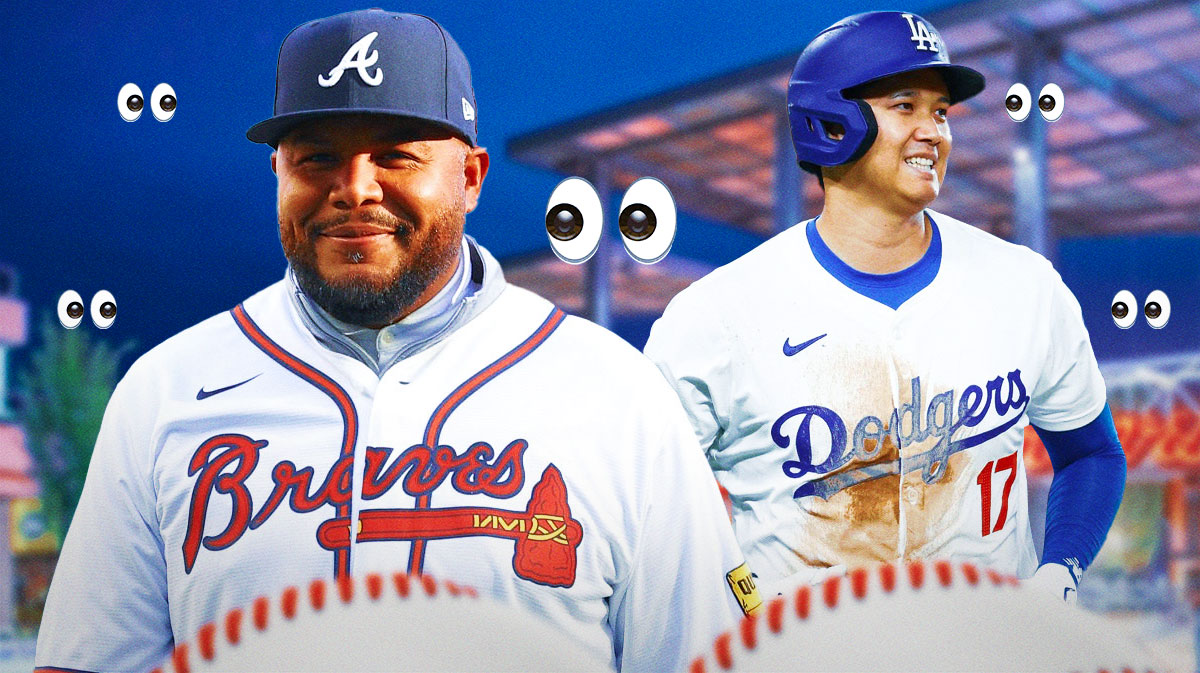 Braves' Andruw Jones with the eyes emojis all over him while smiling at Dodgers' Shohei Ohtani