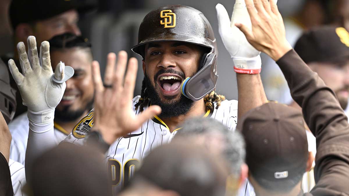 San Diego Padres designated hitter Fernando Tatis Jr. (23) is congratulated in the dugout after hitting a home run against the Houston Astros during the eighth inning at Petco Park.