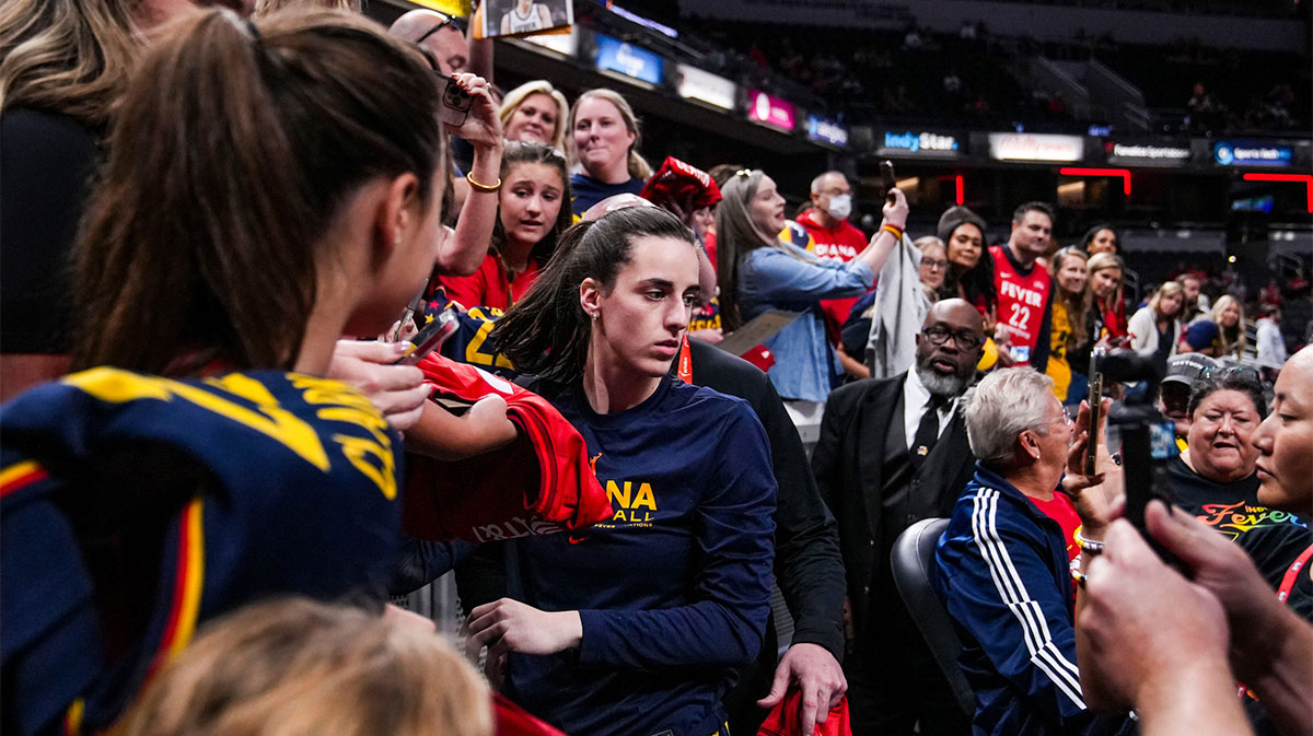 Indiana Fever guard Caitlin Clark (22) signs merchandise Friday, September 6, 2024, during a game between the Indiana Fever and the Minnesota Lynx at Gainbride Fieldhouse in Indianapolis.