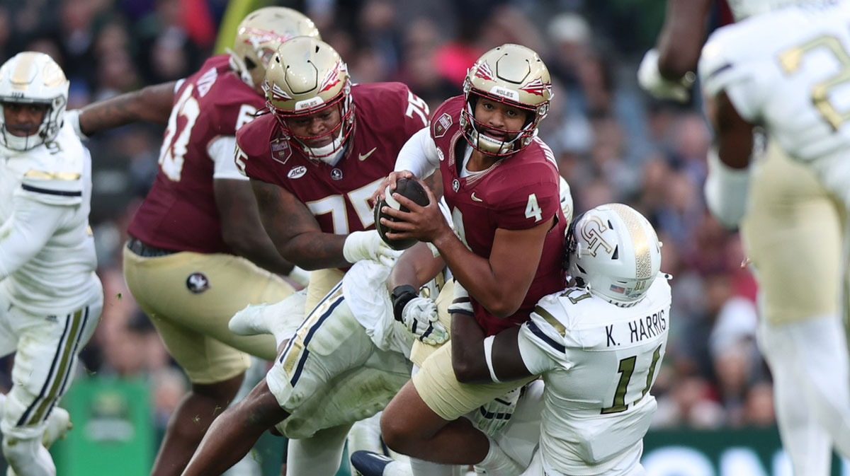 Georgia Tech defensive lineman Kevin Harris II tackles Florida State University quarterback DJ Uiagalelei at Aviva Stadium.