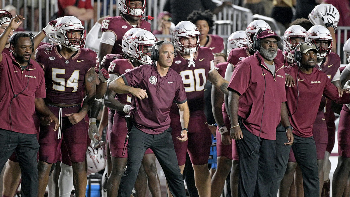 Florida State Seminoles head coach Mike Norvell and his team watch the time tick off of the clock during the fourth quarter against the California Golden Bears at Doak S. Campbell Stadium