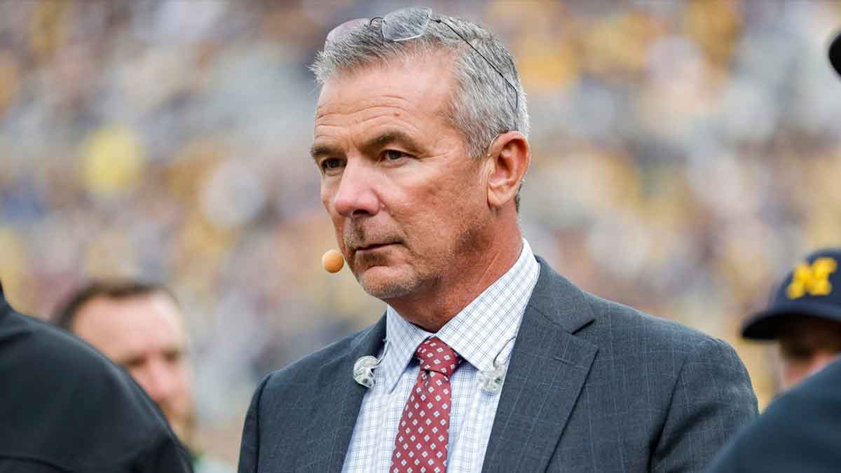 OX Sports college football analyst Urban Meyer walks along the sideline before a game between Michigan and Maryland at Michigan Stadium in Ann Arbor on Saturday, Sept. 24, 2022.