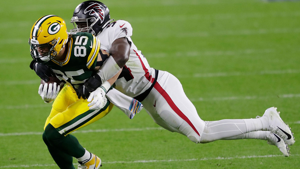 Green Bay Packers tight end Robert Tonyan (85) is tackled by Atlanta Falcons linebacker Foye Oluokun (54) in the second quarter during their football game Monday, Oct. 5, 2020, at Lambeau Field in Green Bay, Wis. Apc Packvsfalcons 1005200721b