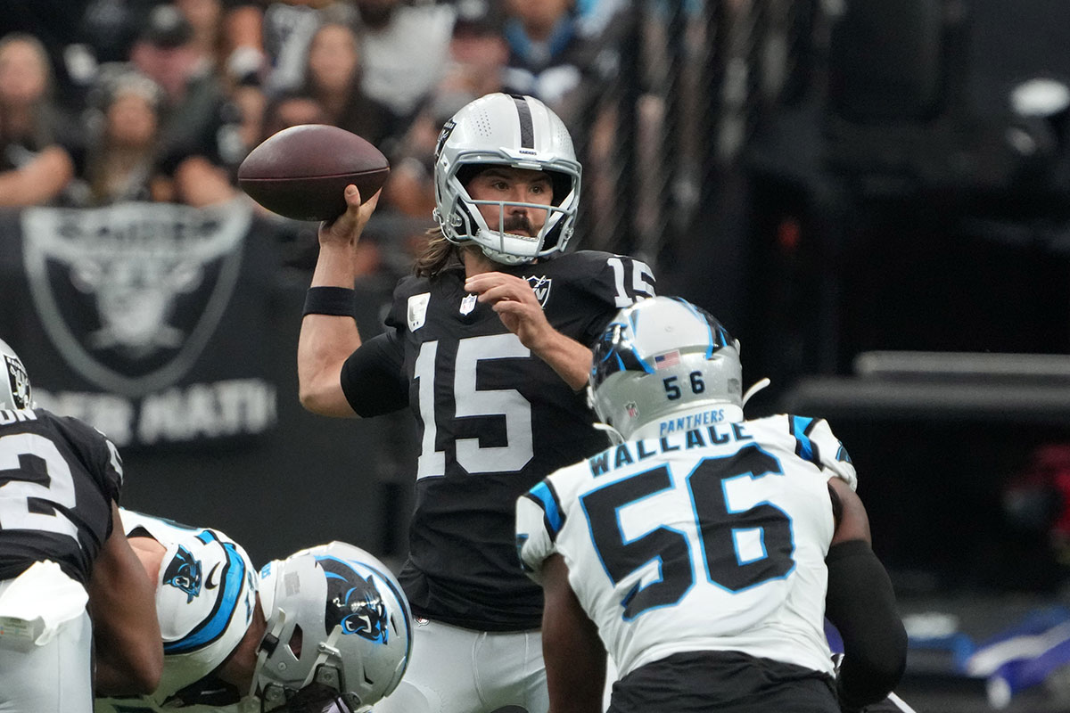 Las Vegas Raiders quarterback Gardner Minshew (15) throws the ball against the Carolina Panthers in the first half at Allegiant Stadium.