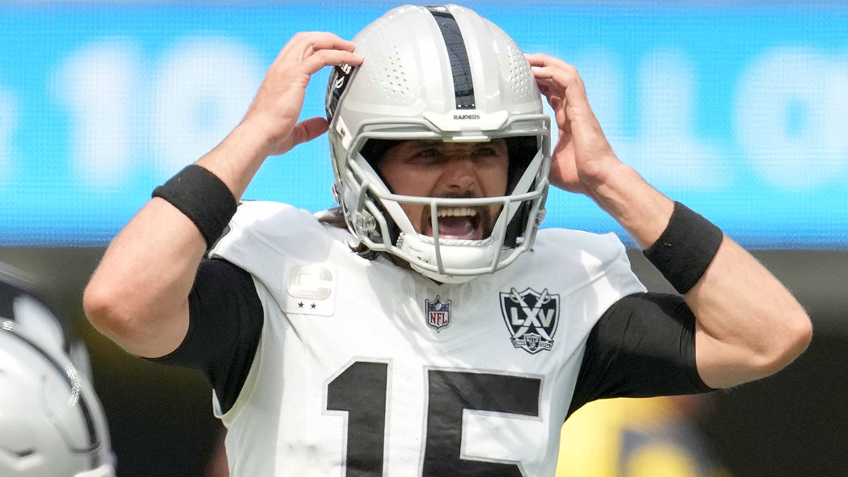 Sep 8, 2024; Inglewood, California, USA; Las Vegas Raiders quarterback Gardner Minshew (15) prepares to take the snap against the Los Angeles Chargers in the first half at SoFi Stadium. 