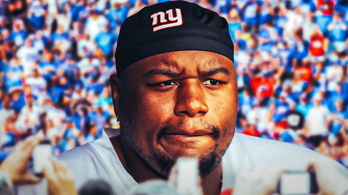 Dexter Lawrence serious face with Giants fans in the background.