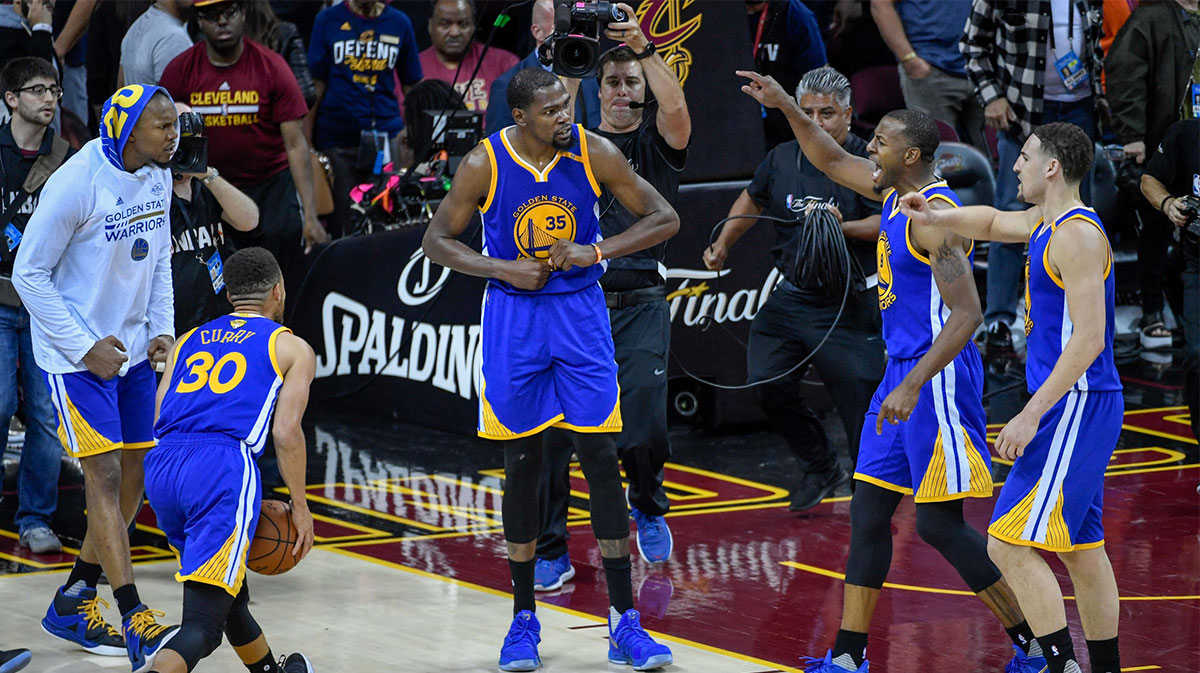 Golden State Warriors forward Kevin Durant (35) celebrates with forward Andre Iguodala (9) and guard Klay Thompson (11) after game three of the 2017 NBA Finals against the Cleveland Cavaliers at Quicken Loans Arena. 