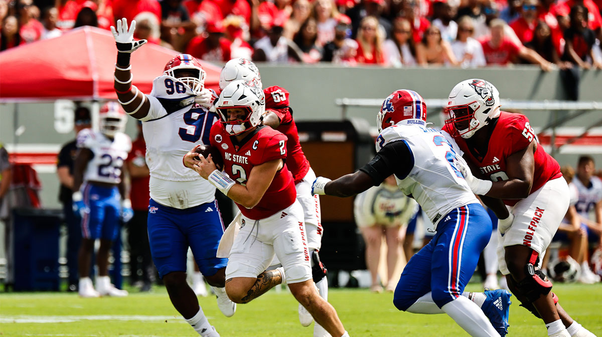 North Carolina State Wolfpack quarterback Grayson McCall (2) runs with the football against the Louisiana Tech Bulldogs during the first half at Carter-Finley Stadium.