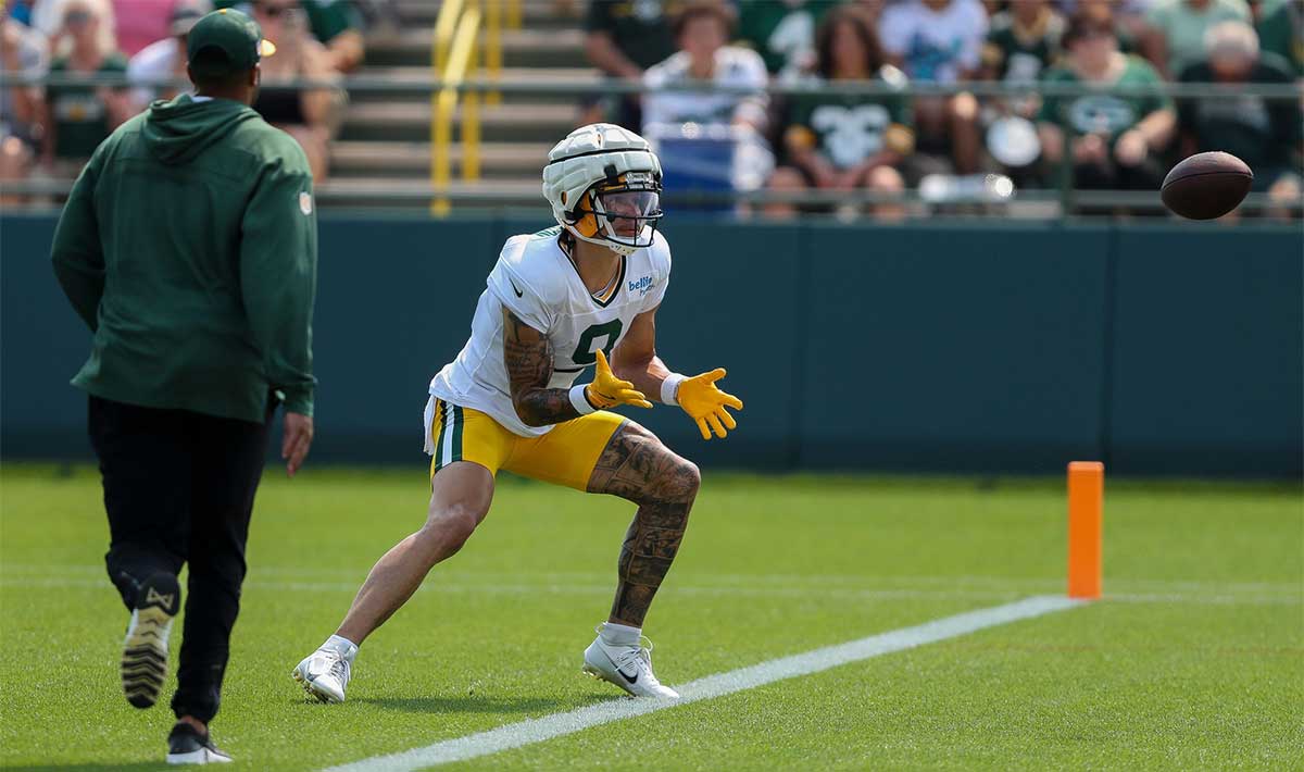 Green Bay Packers wide receiver Christian Watson (9) catches a pass during the seventh practice of training camp on Tuesday, July 30, 2024, at Ray Nitschke Field in Ashwaubenon, Wis.