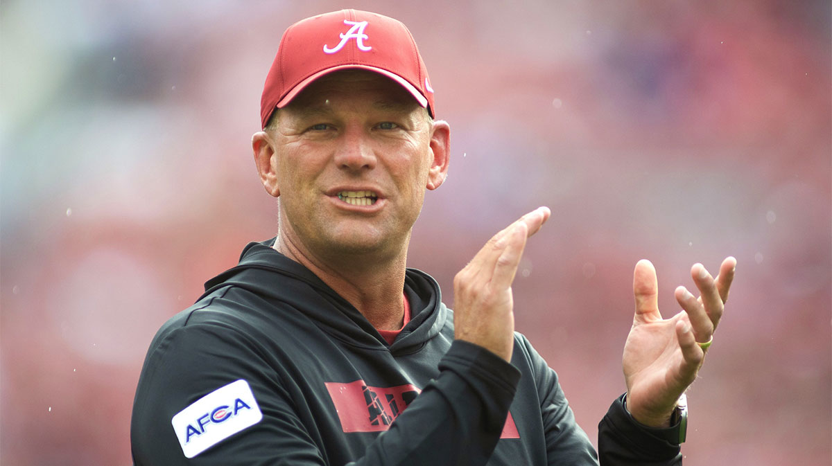 Alabama Crimson Tide head coach Kalen DeBoer coaches his players during warm ups before their game against the Western Kentucky Hilltoppers at Bryant-Denny Stadium.
