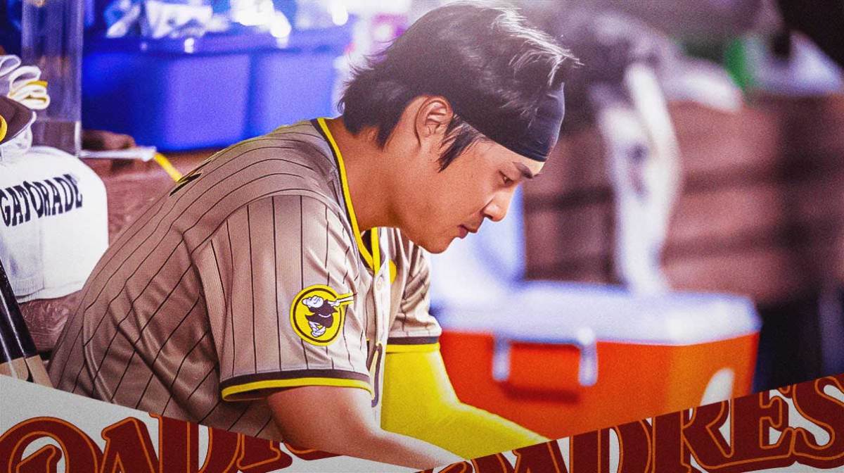 Padres Ha-Seong Kim looking serious and sitting in an MLB dugout.