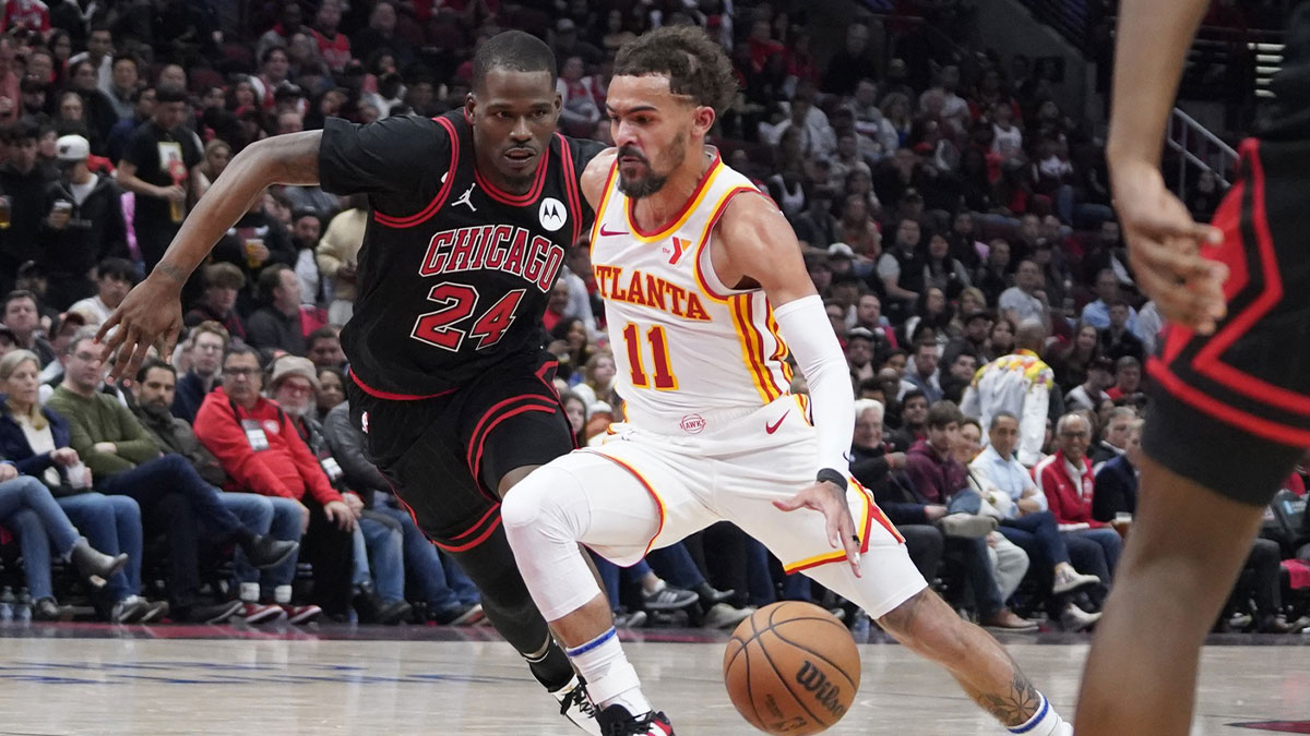 Chicago Bulls guard Javonte Green (24) defends Atlanta Hawks guard Trae Young (11) during the second half of a 2024 NBA Playoffs playoff game at United Center.