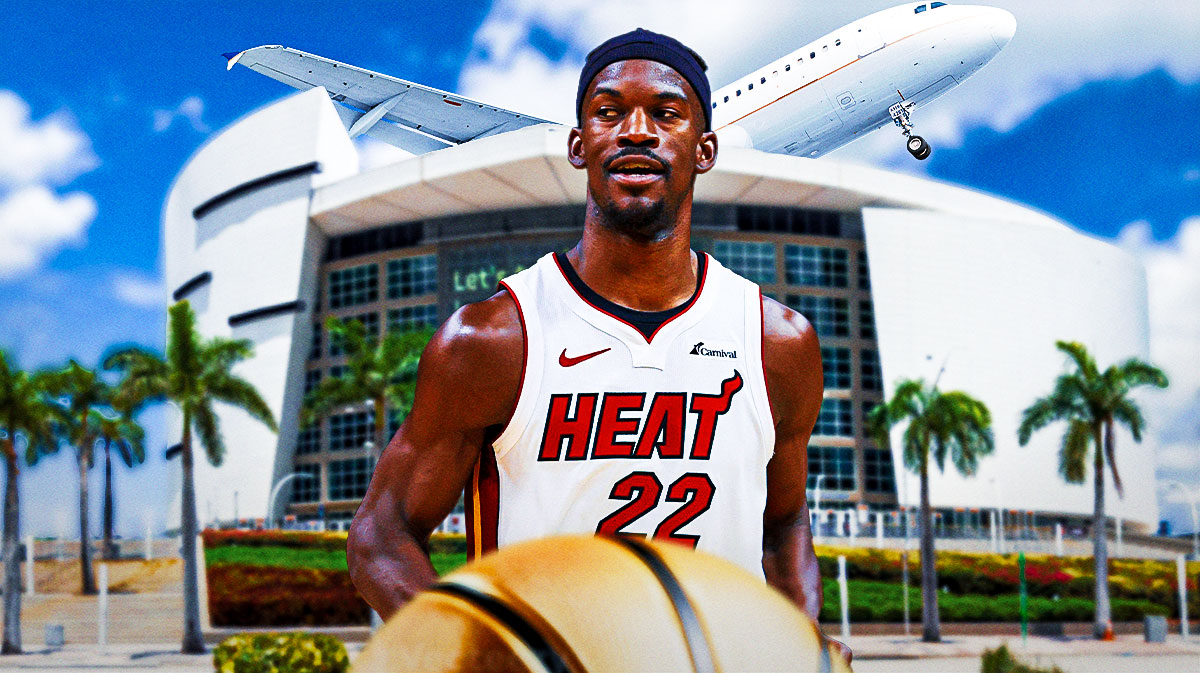 Heat star Jimmy Butler, Kaseya Center in back, an airplane above