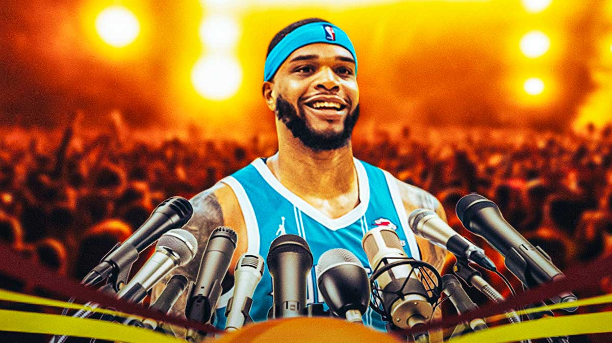 Charlotte Hornets forward Miles Bridges, talking into a microphone, with the background of a nightclub behind him.
