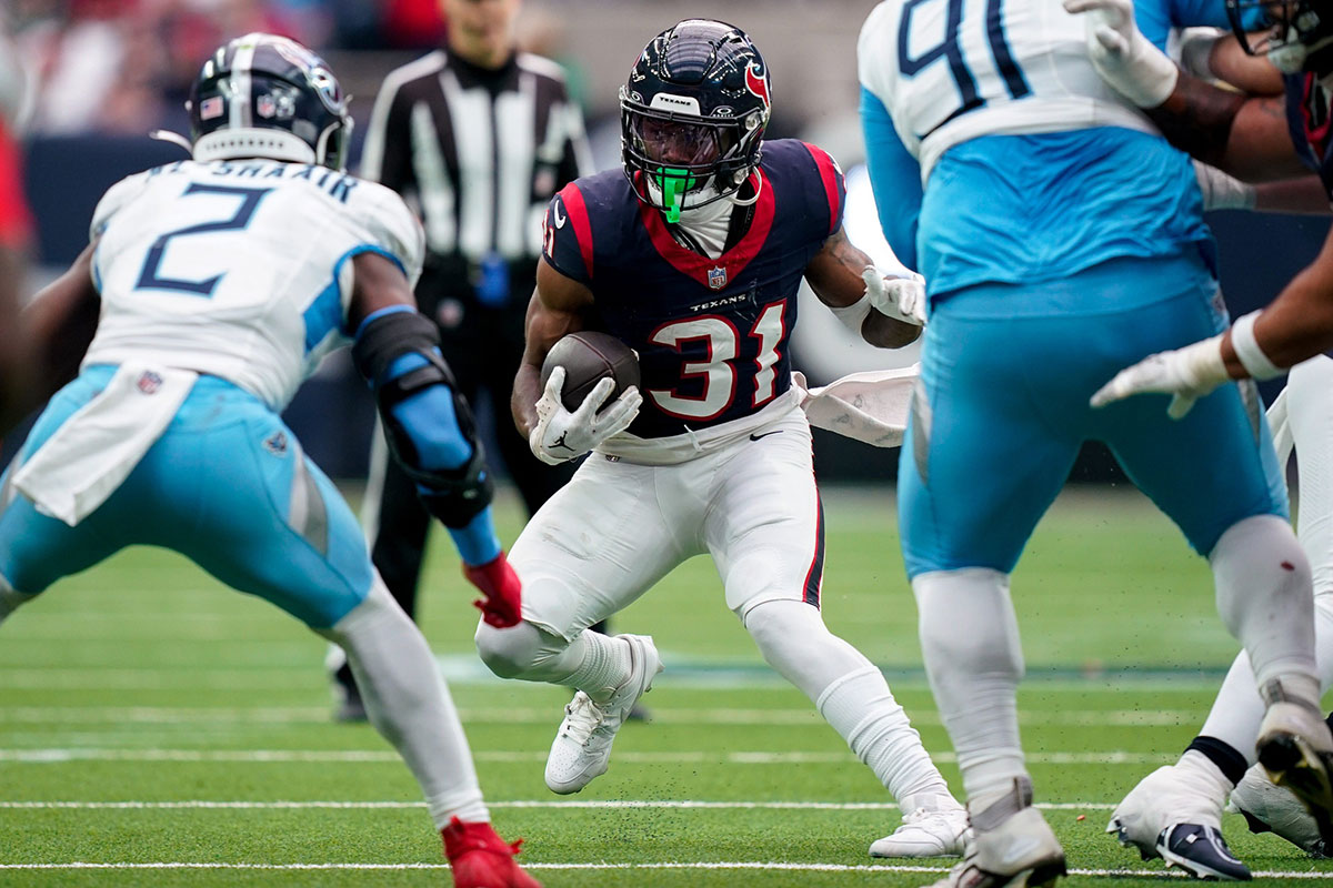 Houston Texans running back Dameon Pierce (31) runs the ball against the Tennessee Titans during the second quarter at NRG Stadium.