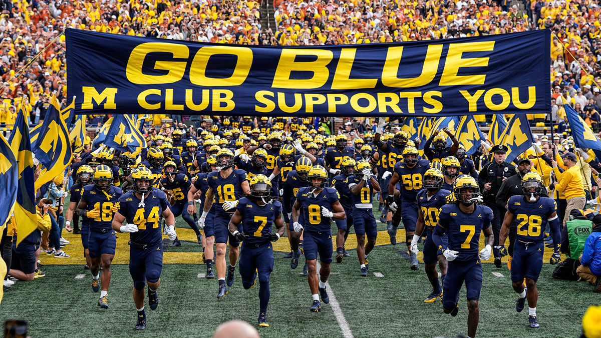 Michigan players take the field for the first half against Texas at Michigan Stadium in Ann Arbor