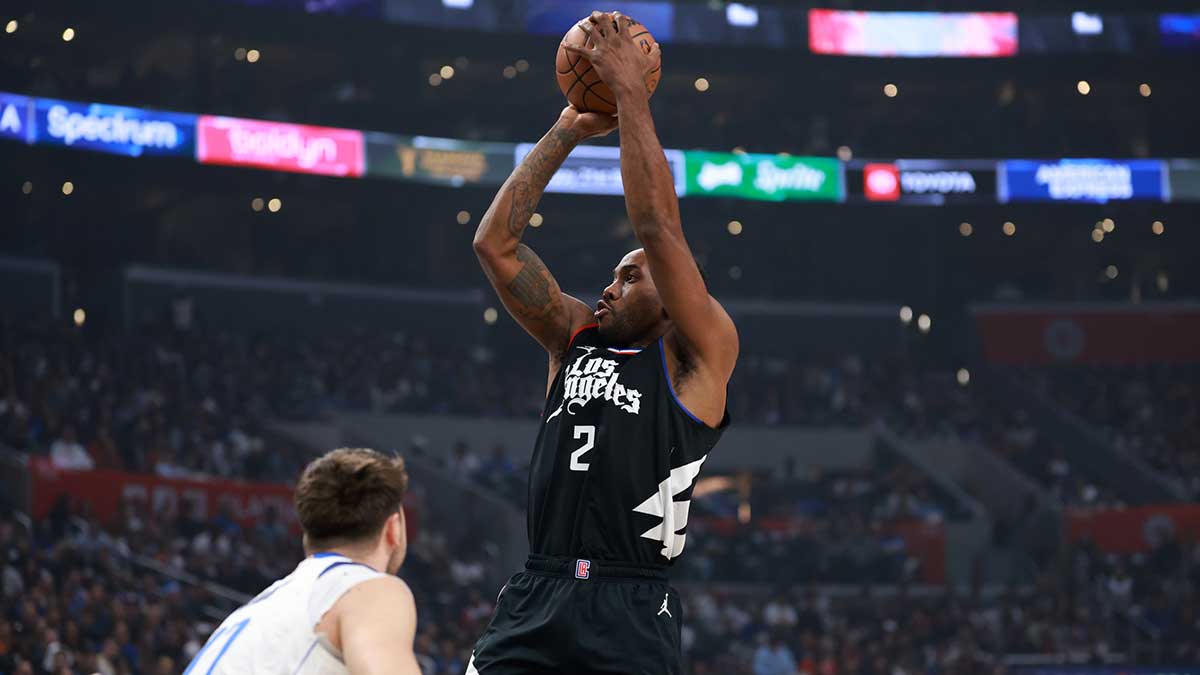 Los Angeles Clippers forward Kawhi Leonard (2) shoots the ball over Dallas Mavericks guard Luka Doncic (77) in the first quarter of game two of the first round for the 2024 NBA playoffs at Crypto.com Arena.