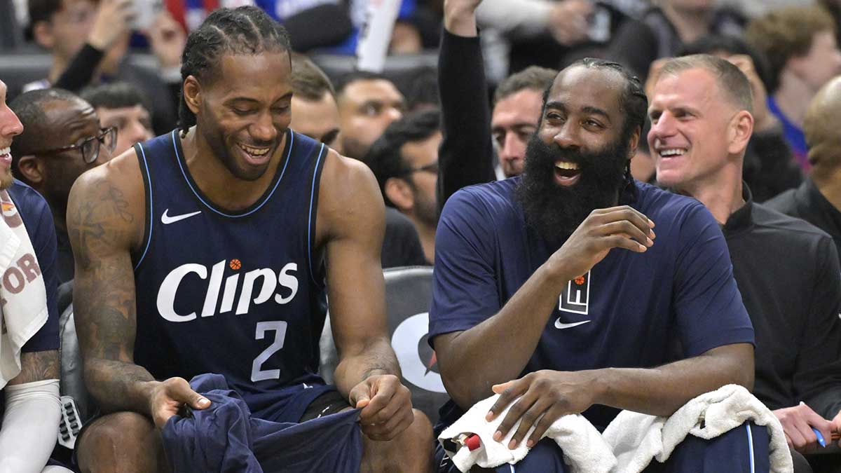 Los Angeles Clippers forward Kawhi Leonard (2) laughs with guard James Harden (1) on the bench in the second half against the Washington Wizards at Crypto.com Arena.