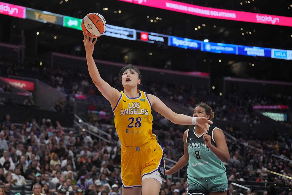 LA Sparks center Li Yueru (28) shoots the ball against New York Liberty forward Nyara Sabally (8 in the second half at Crypto.com Arena.
