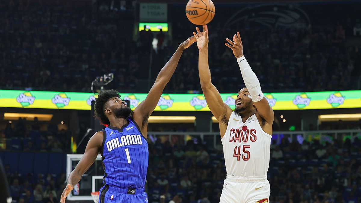 Cleveland Cavaliers guard Donovan Mitchell (45) shoots the ball against Orlando Magic forward Jonathan Isaac (1) during the first quarter of Game 6 of the first round of the 2024 NBA Playoffs at Kia Center.