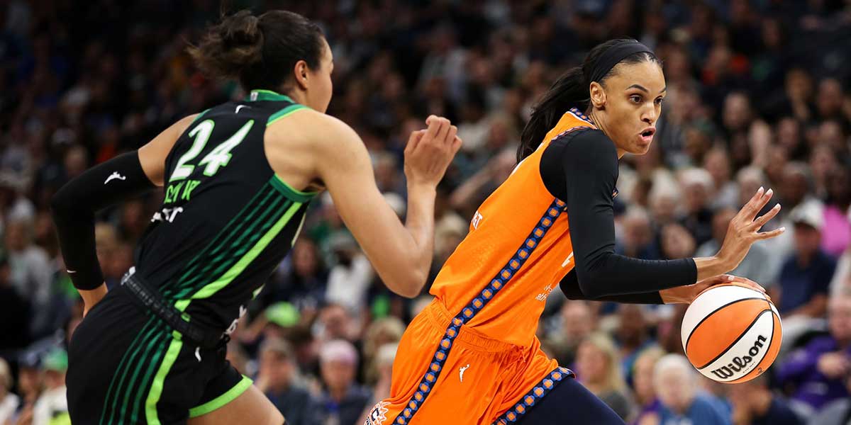 Connecticut Sun forward DeWanna Bonner (24) works around Minnesota Lynx forward Napheesa Collier (24) during the first half of game one of the 2024 WNBA Semi-finals at Target Center.