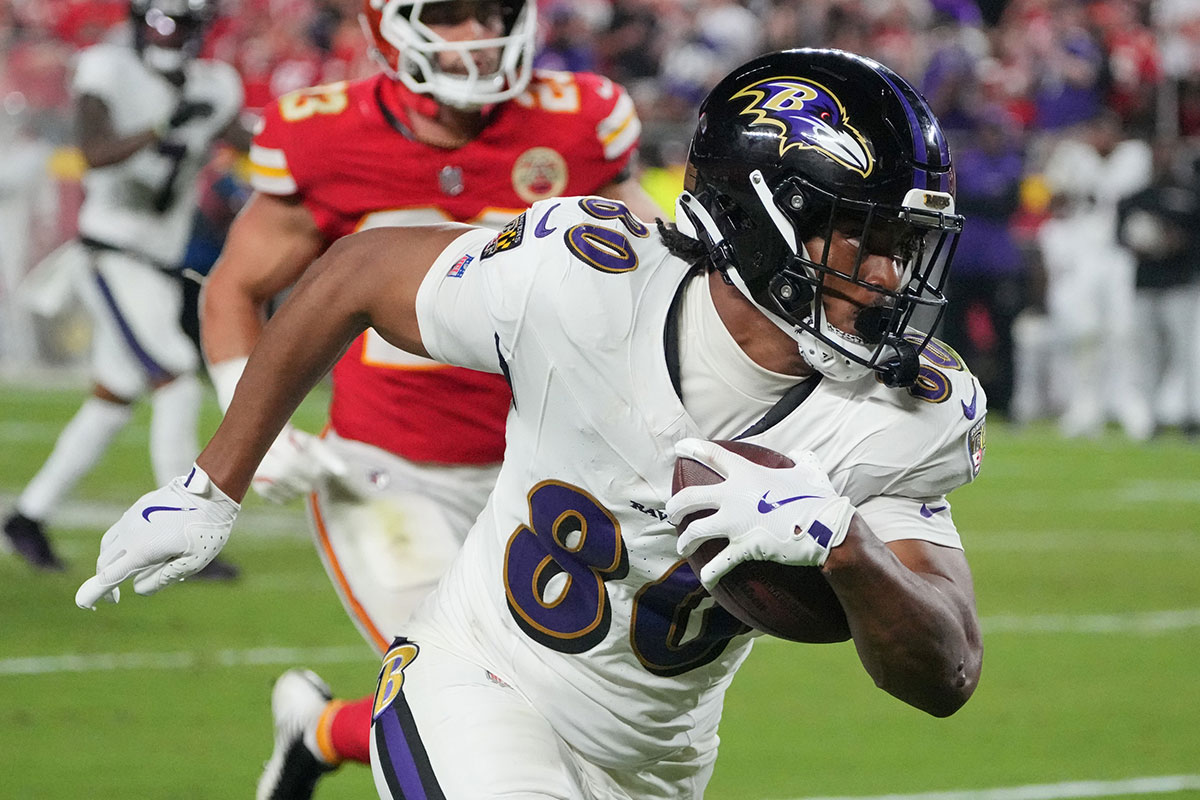 Baltimore Ravens tight end Isaiah Likely (80) runs the ball against the Kansas City Chiefs during the second half at GEHA Field at Arrowhead Stadium.