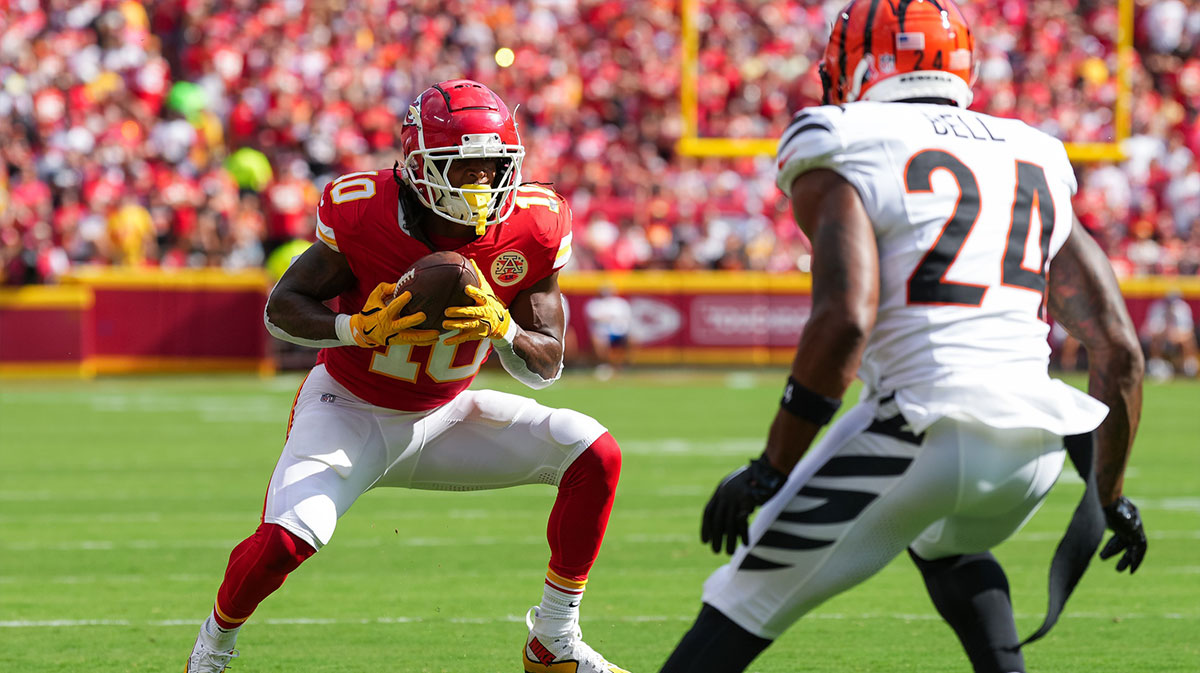 Kansas City Chiefs running back Isiah Pacheco (10) catches a pass against Cincinnati Bengals safety Vonn Bell (24) at GEHA Field at Arrowhead Stadium.