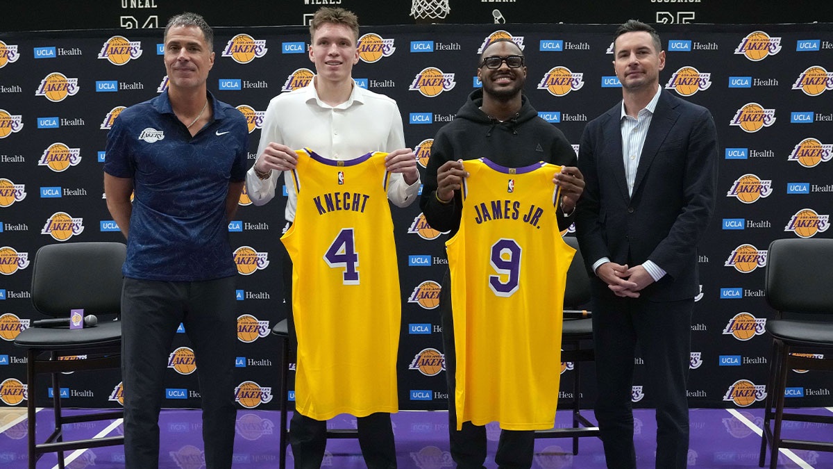 Los Angeles Lakers general manager Rob Pelinka, first-round draft pick Dalton Knecht (4), second-round draft pick Bronny James (9) and coach JJ Redick hold a press conference with Kat at the UCLA Health Training Center.