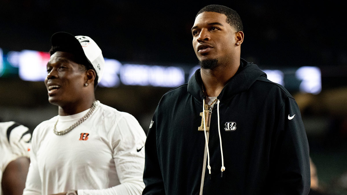Cincinnati Bengals wide receiver Ja'Marr Chase (1) walks off the field with Cincinnati Bengals cornerback Cam Taylor-Britt (29) after the NFL preseason game