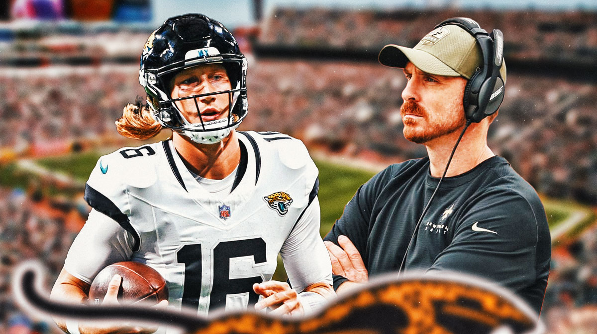 Trevor Lawrence and Ryan Nielsen in front of the Jaguars stadium