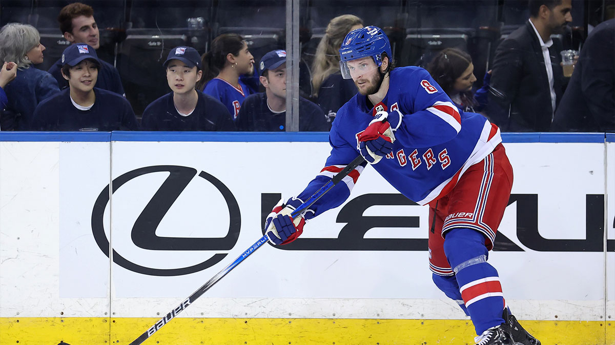 New York Rangers defenseman Jacob Trouba (8) controls the puck against the Florida Panthers during the third period of game one of the Eastern Conference Final of the 2024 Stanley Cup Playoffs at Madison Square Garden.