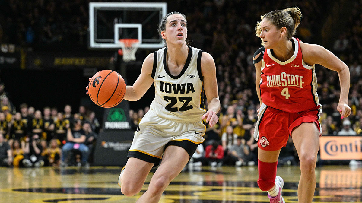Iowa Hawkeyes guard Caitlin Clark (22) goes to the basket as Ohio State Buckeyes guard Jacy Sheldon (4) defends during the game at Carver-Hawkeye Arena.