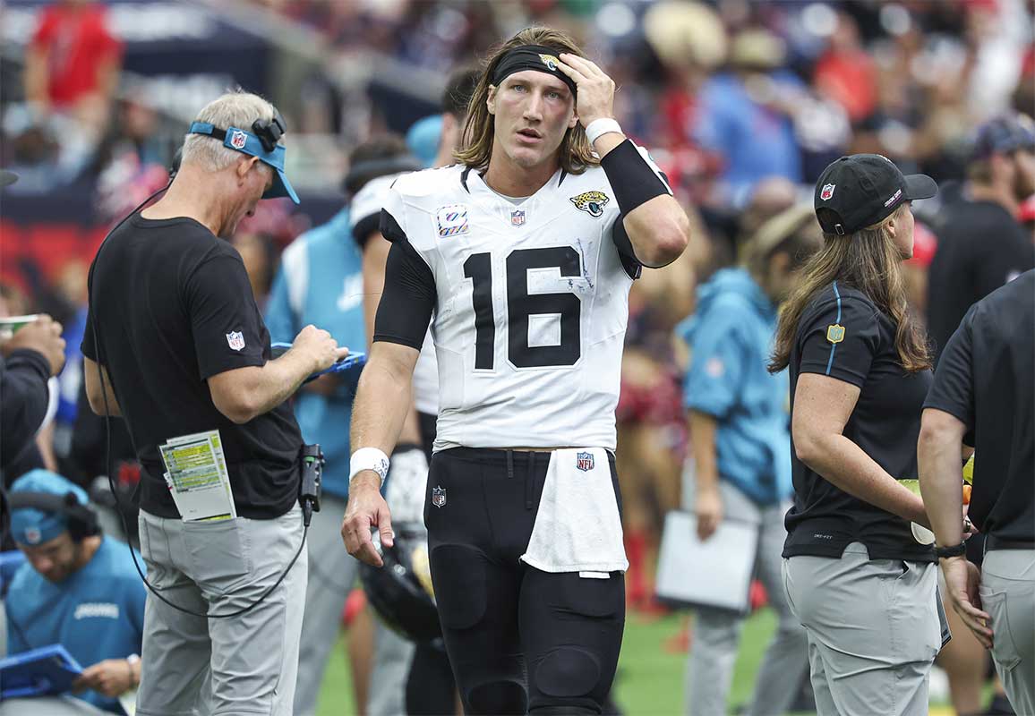 Jacksonville Jaguars quarterback Trevor Lawrence (16) walks on the sideline during the fourth quarter against the Houston Texans at NRG Stadium.