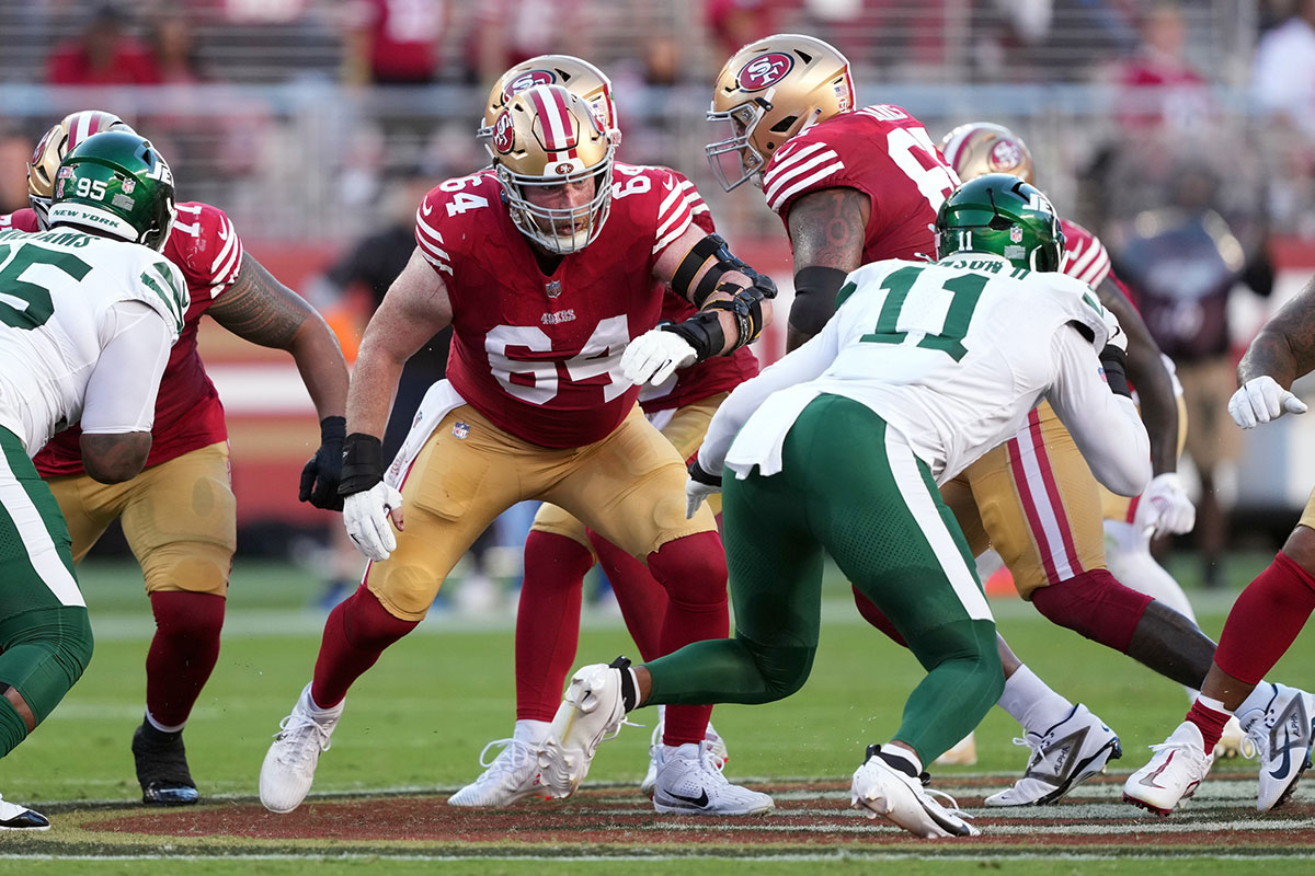 San Francisco 49ers center Jake Brendel (64) blocks against New York Jets linebacker Jermaine Johnson (11) during the second quarter at Levi's Stadium.