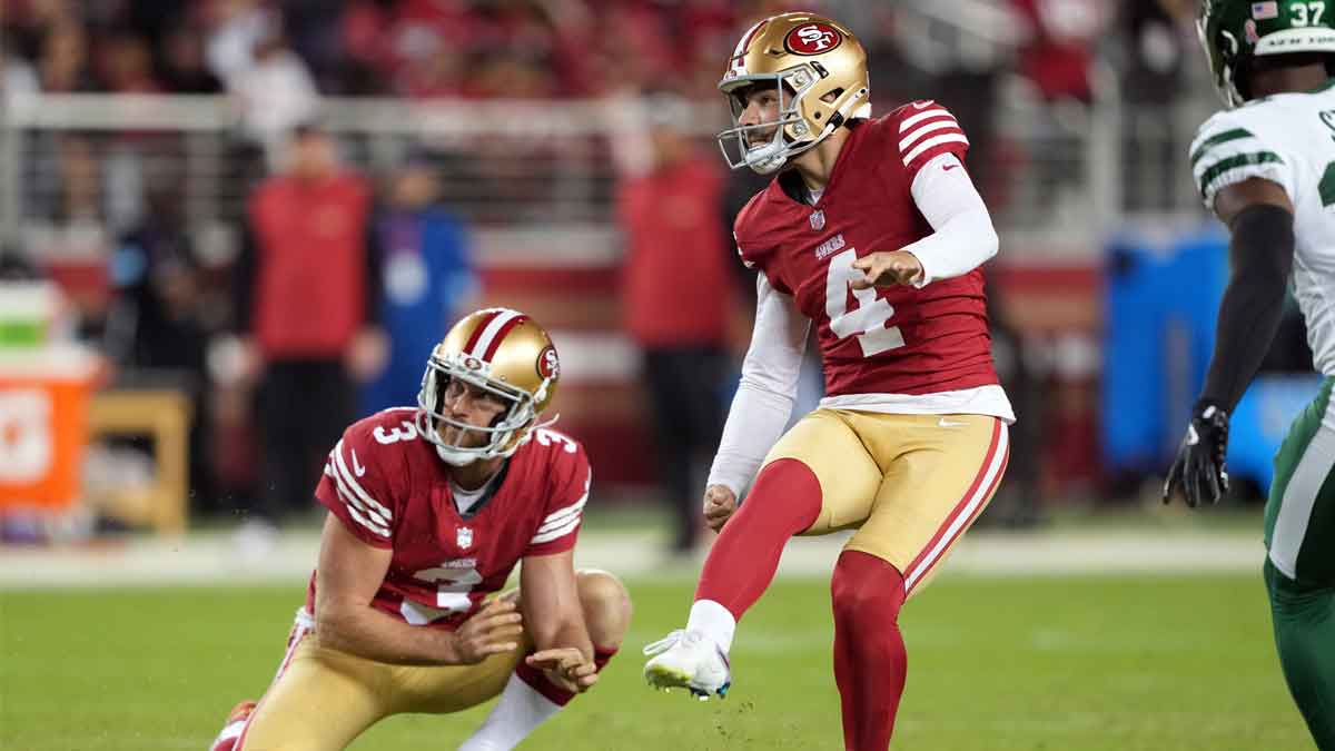 San Francisco 49ers place kicker Jake Moody (4) kicks a field goal against the New York Jets as punter Mitch Wishnowsky (3) holds during the fourth quarter at Levi's Stadium.