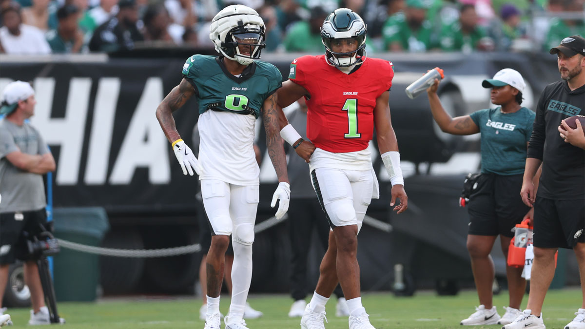 Philadelphia Eagles quarterback Jalen Hurts (1) talks with wide receiver DeVonta Smith (6) during a training camp practice at Lincoln Financial Field.