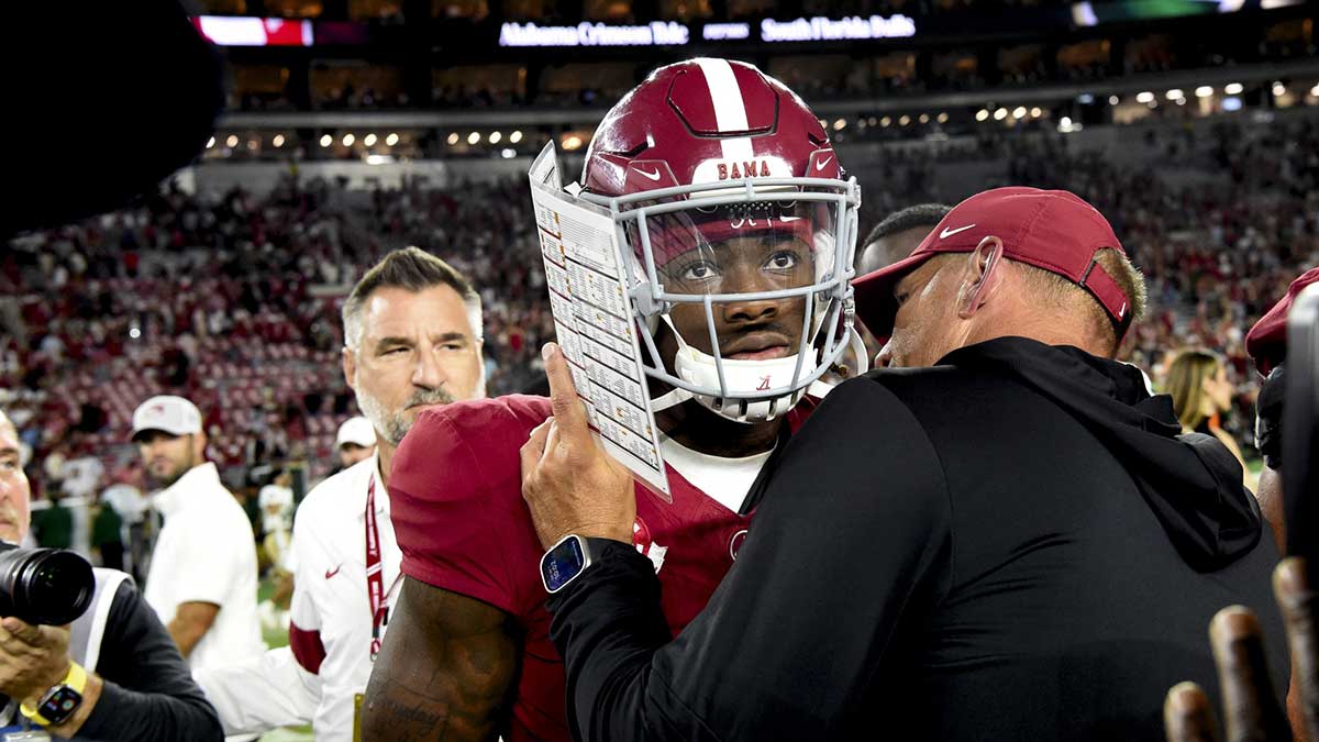Alabama Crimson Tide head coach Kalen DeBoer gives some encouragement to quarterback Jalen Milroe (4) at Bryant-Denny Stadium after defeating the South Florida Bulls