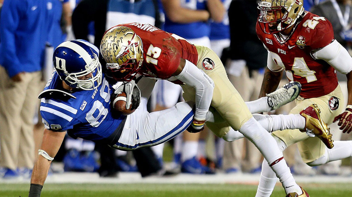 Florida State defensive back Jalen Ramsey (13) makes a hard tackle on Duke's Braxton Deaver