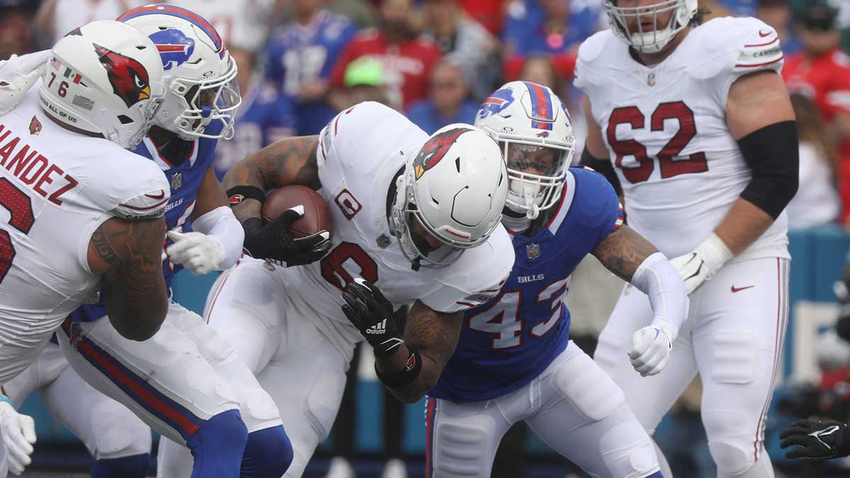 Bills Terrel Bernard tries unsuccessfully to keep Arizona's James Conner out of the end zone during first half action at Highmark Stadium in Orchard Park on Sept. 8, 2024.