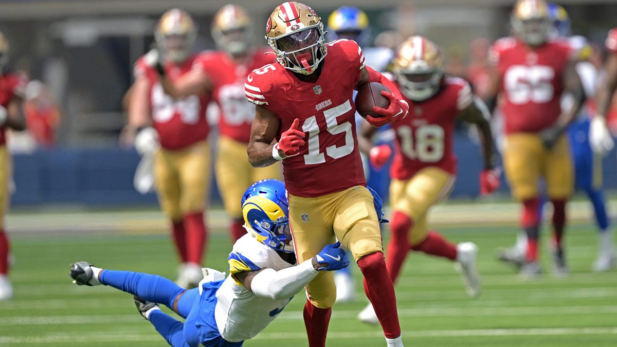 San Francisco 49ers wide receiver Jauan Jennings (15) is stopped by Los Angeles Rams safety Kamren Curl (3) after a first down in the first half at SoFi Stadium. 