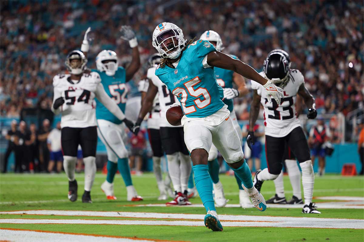 Miami Dolphins running back Jaylen Wright (25) celebrates after scoring a touchdown against the Atlanta Falcons in the second quarter during preseason at Hard Rock Stadium.