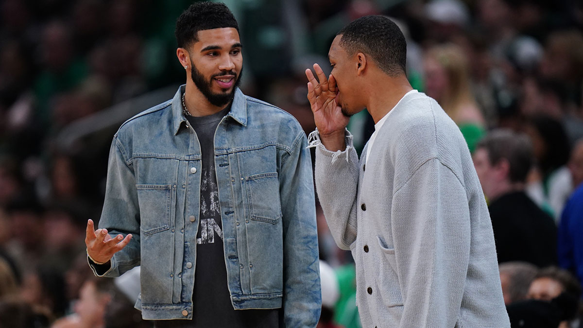 Boston Celtics forward Jayson Tatum (0) talks with former teammate Charlotte Hornets forward Grant Williams (2) in the second half at TD Garden.