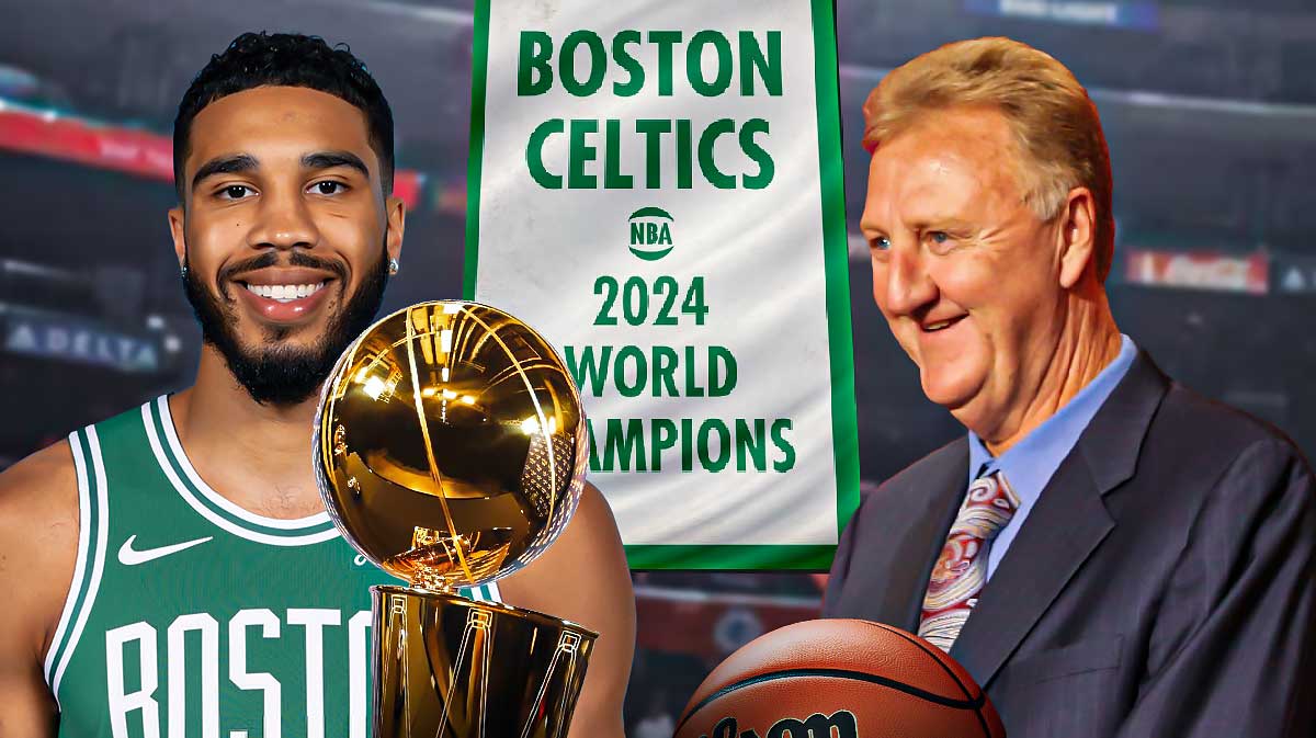 Celtics superstar Jayson Tatum next to Larry Bird, the Larry O'Brien trophy and the 2024 Celtics championship banner