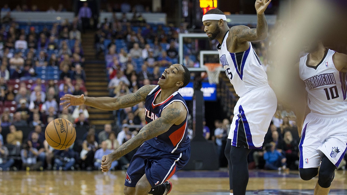 Atlanta Hawks point guard Jeff Teague (0) reacts after being fouled by Sacramento Kings center DeMarcus Cousins ​​(15) during the first quarter at Sleep Train Arena. 